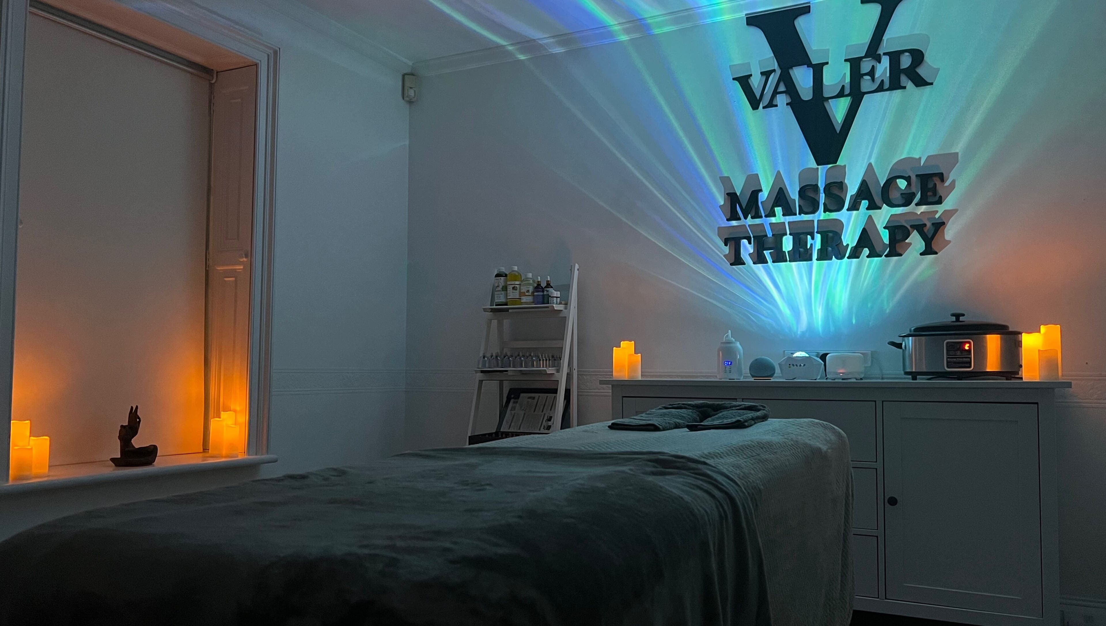 Relaxing therapy room at VALER Massage Therapist and Male Waxing in Ruislip, England, GB with ambient lighting.