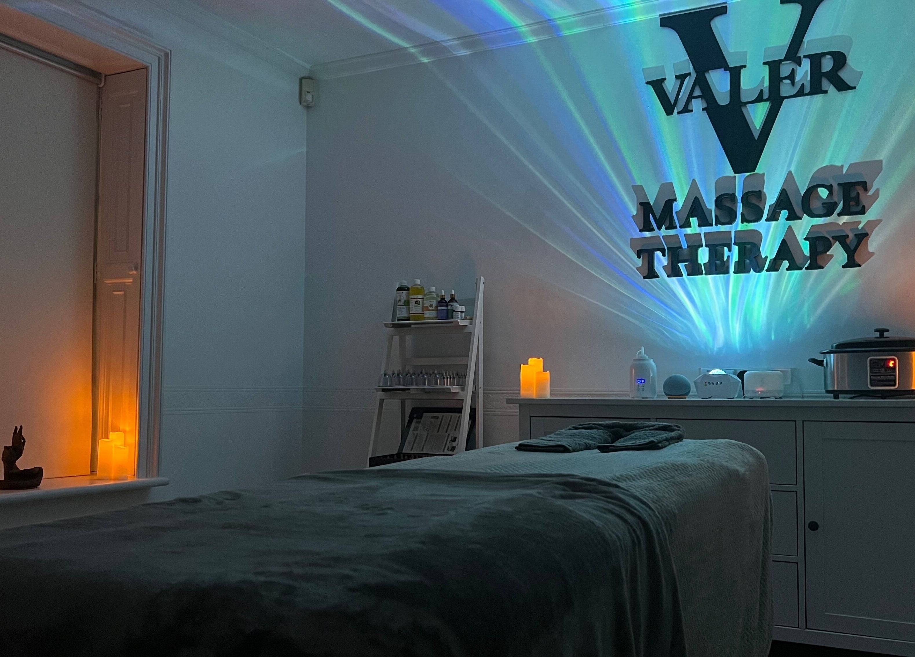 Relaxing therapy room at VALER Massage Therapist and Male Waxing in Ruislip, England, GB with ambient lighting.