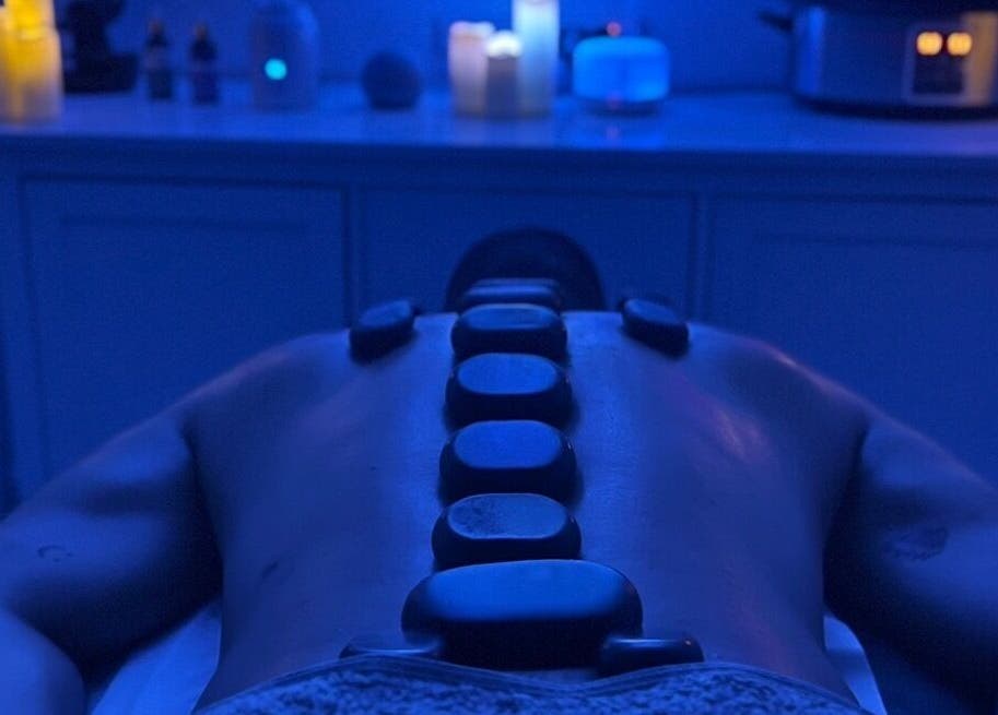 Hot stone therapy session at VALER Massage Therapist and Male Waxing, Ruislip, England, GB. Relaxing spa ambiance.