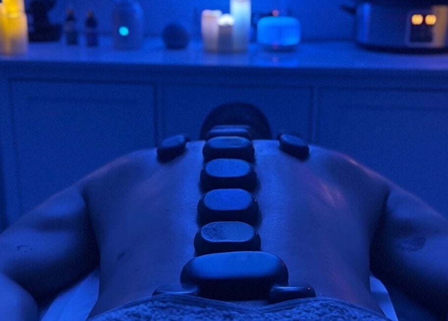 Hot stone therapy session at VALER Massage Therapist and Male Waxing, Ruislip, England, GB. Relaxing spa ambiance.