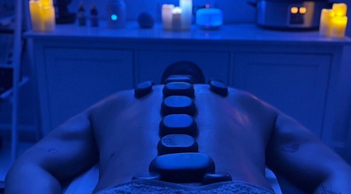 Hot stone therapy session at VALER Massage Therapist and Male Waxing, Ruislip, England, GB. Relaxing spa ambiance.