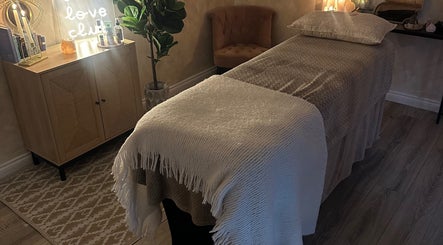 Serenity Seven massage room in Hamilton, Scotland, GB with a cozy setup and soothing decor for relaxation.