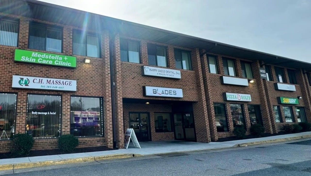 Exterior of CH Massage located in a red brick building in Woodbridge, Virginia, US.
