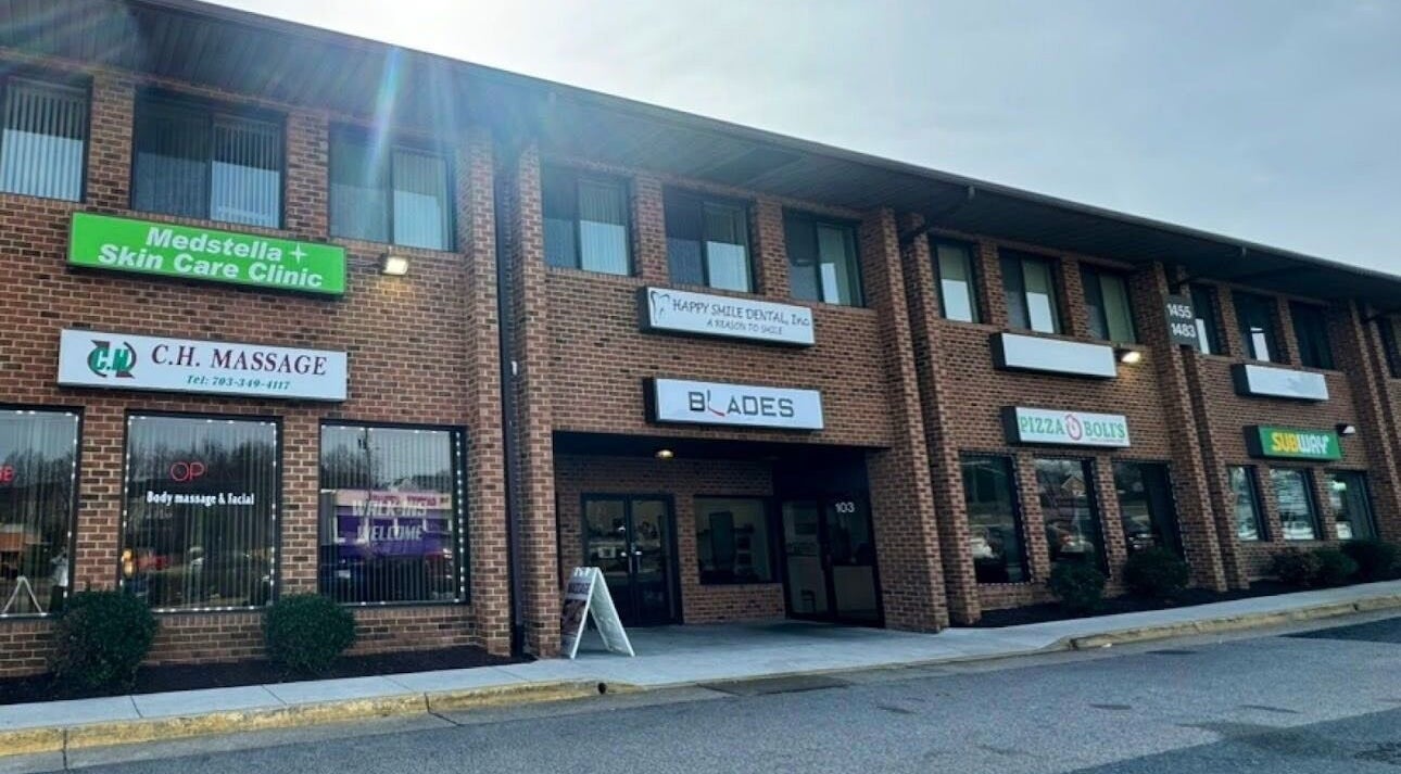 Exterior of CH Massage located in a red brick building in Woodbridge, Virginia, US.