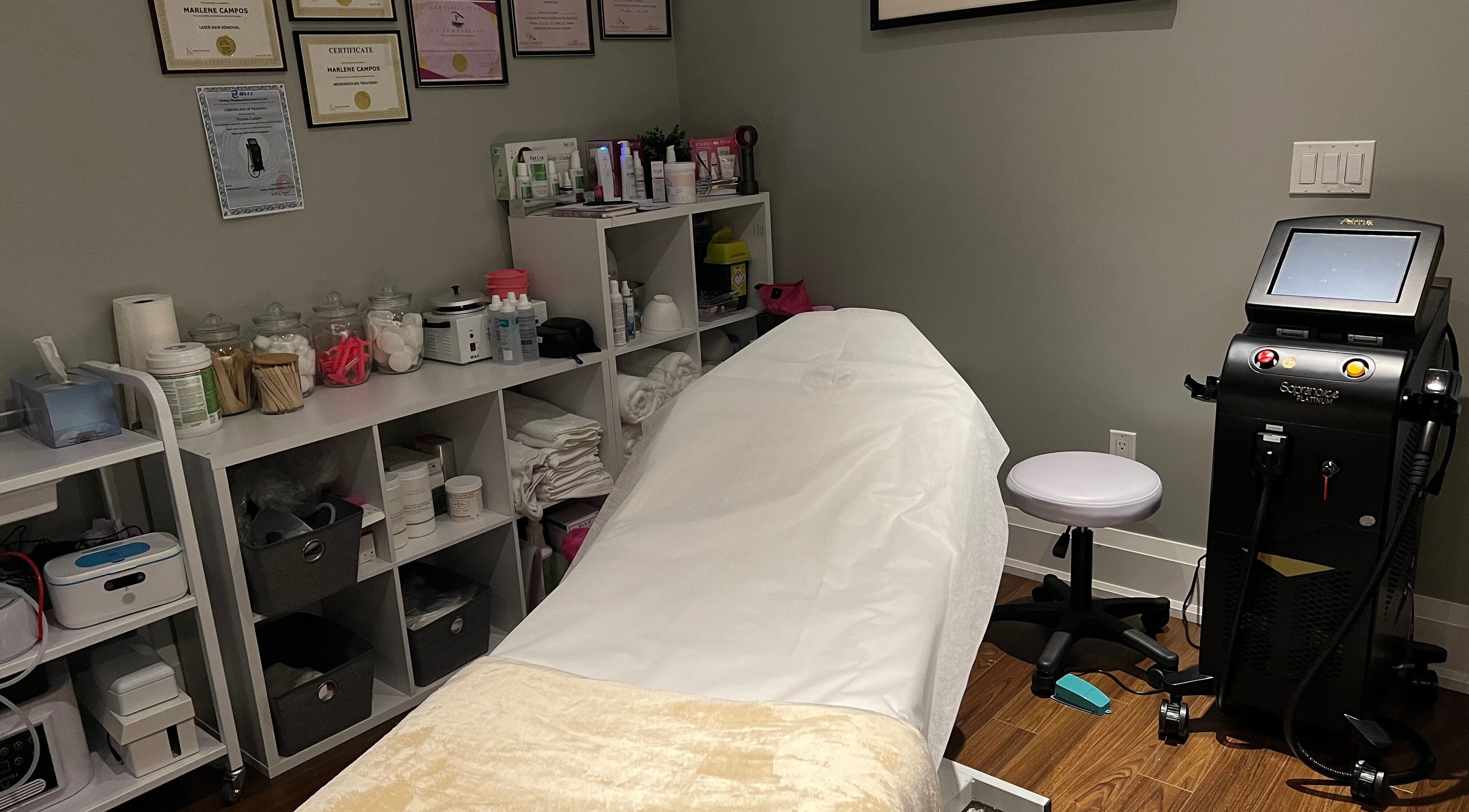 Luxurious treatment room at Mc Beauty Services in Toronto, Ontario, CA featuring a spa bed and high-tech equipment.