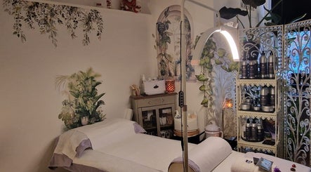 Cozy treatment room at Tranquility in Hastings, England, GB, featuring soothing decor and ambient lighting.