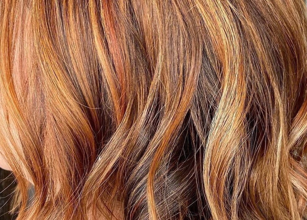 Close-up of vibrant, wavy hair styled at BAE Salon, Woolooware, New South Wales, AU.