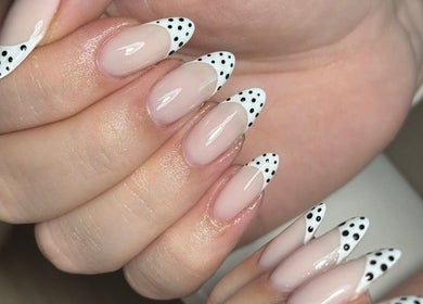 Chic polka dot nail design at Nails by Oliwia, Ellesmere Port, England, GB. Perfect for a trendy look.