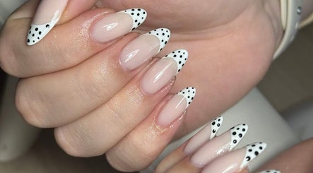 Chic polka dot nail design at Nails by Oliwia, Ellesmere Port, England, GB. Perfect for a trendy look.