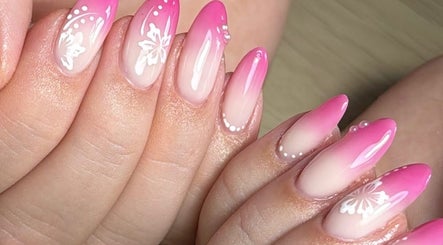 Elegant pink ombre nails with floral art at Nails by Oliwia, Ellesmere Port, England, GB.