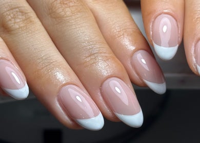 French manicure at Nails by Oliwia, Ellesmere Port, England, GB. Classic elegance with glossy nude and white tips.