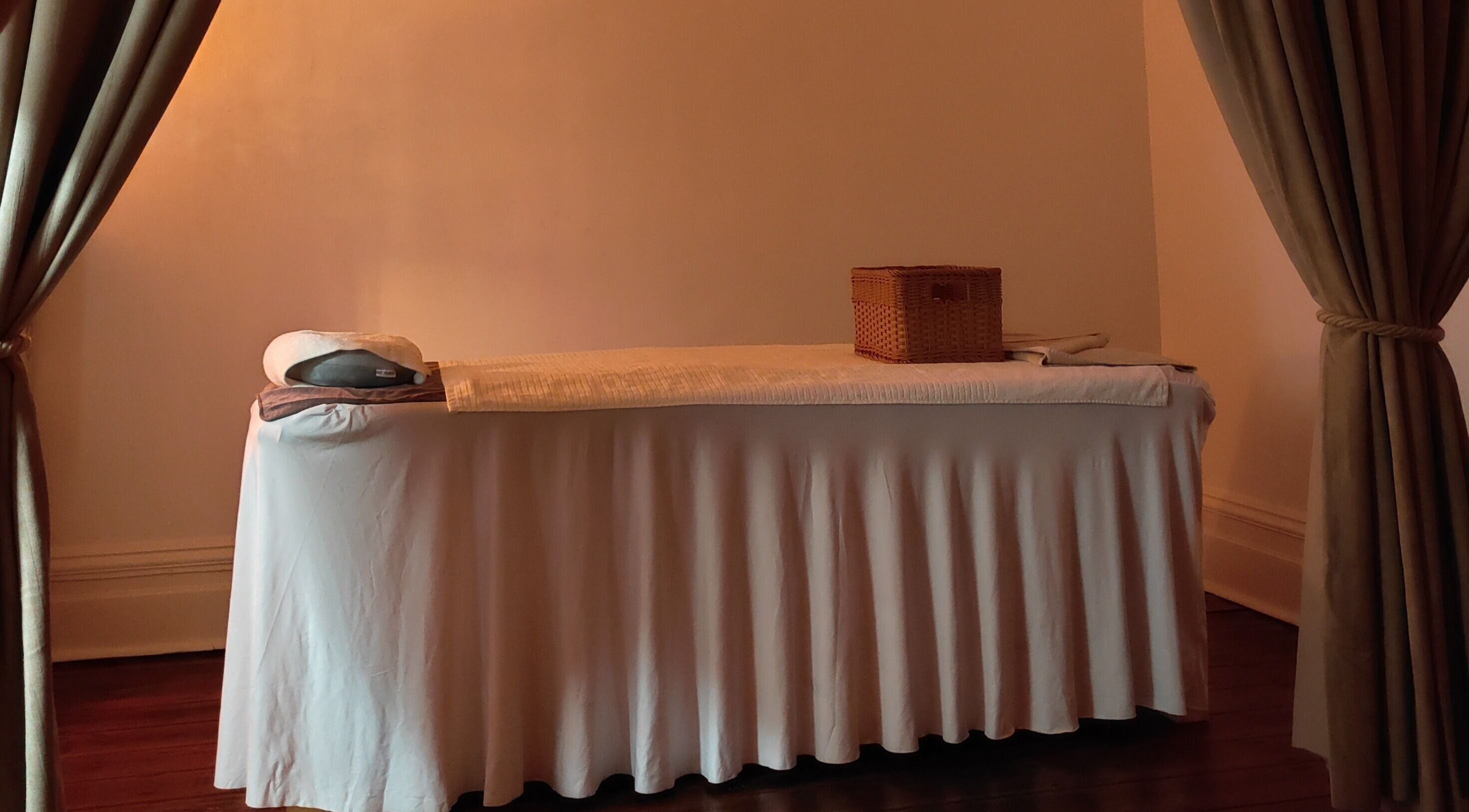 Cozy massage room at Unley Thai Massage, Unley, South Australia, featuring a massage table and soft ambient lighting.