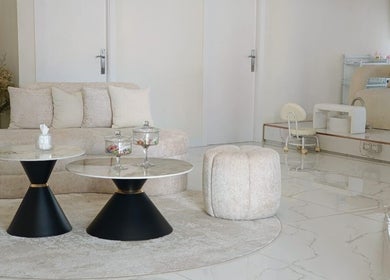 Spacious lounge at Palm Aura Beauty Salon, Dubai, Dubai, AE, featuring elegant seating and modern decor.