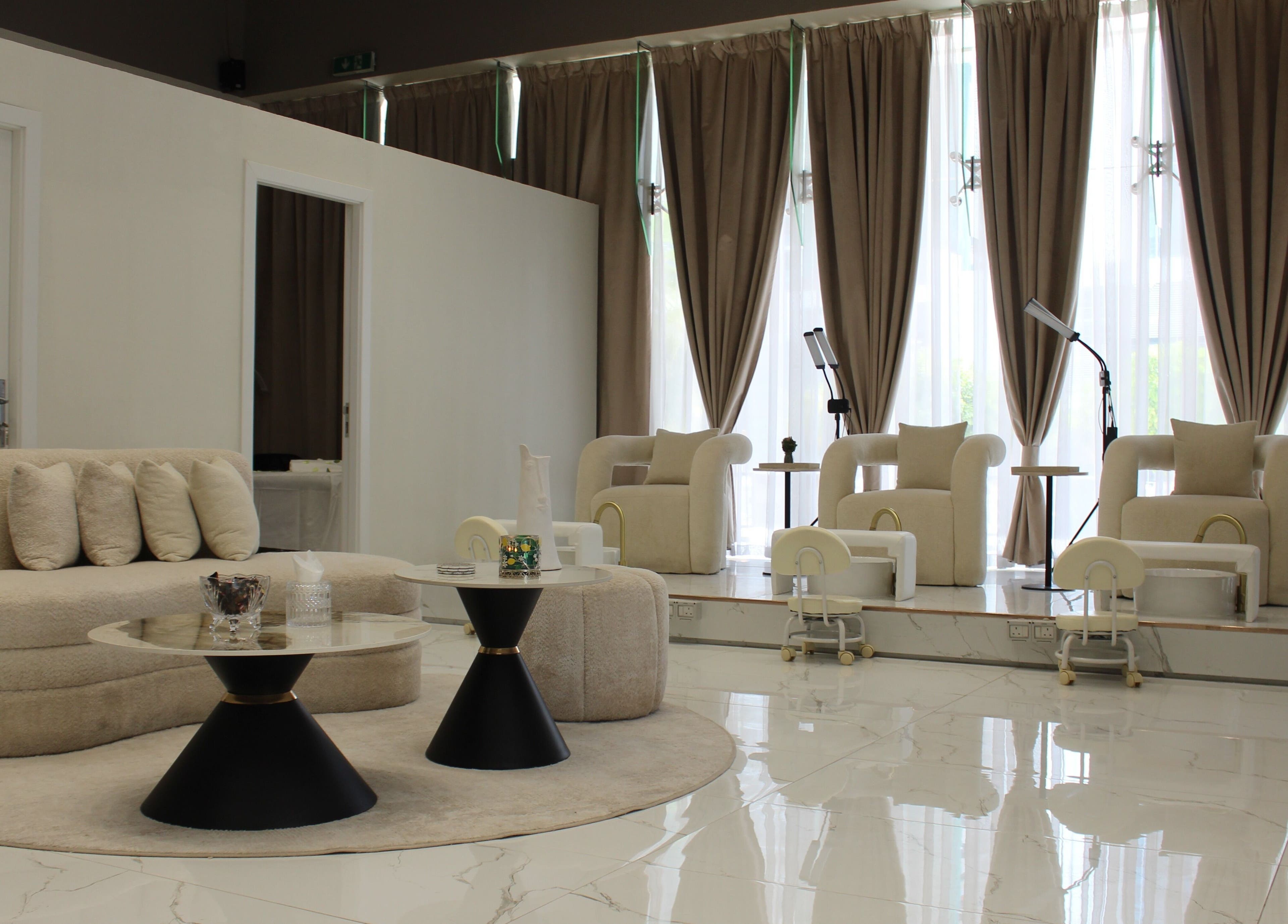 Luxurious lounge seating at Palm Aura Beauty Salon, Dubai, Dubai, AE with elegant decor.