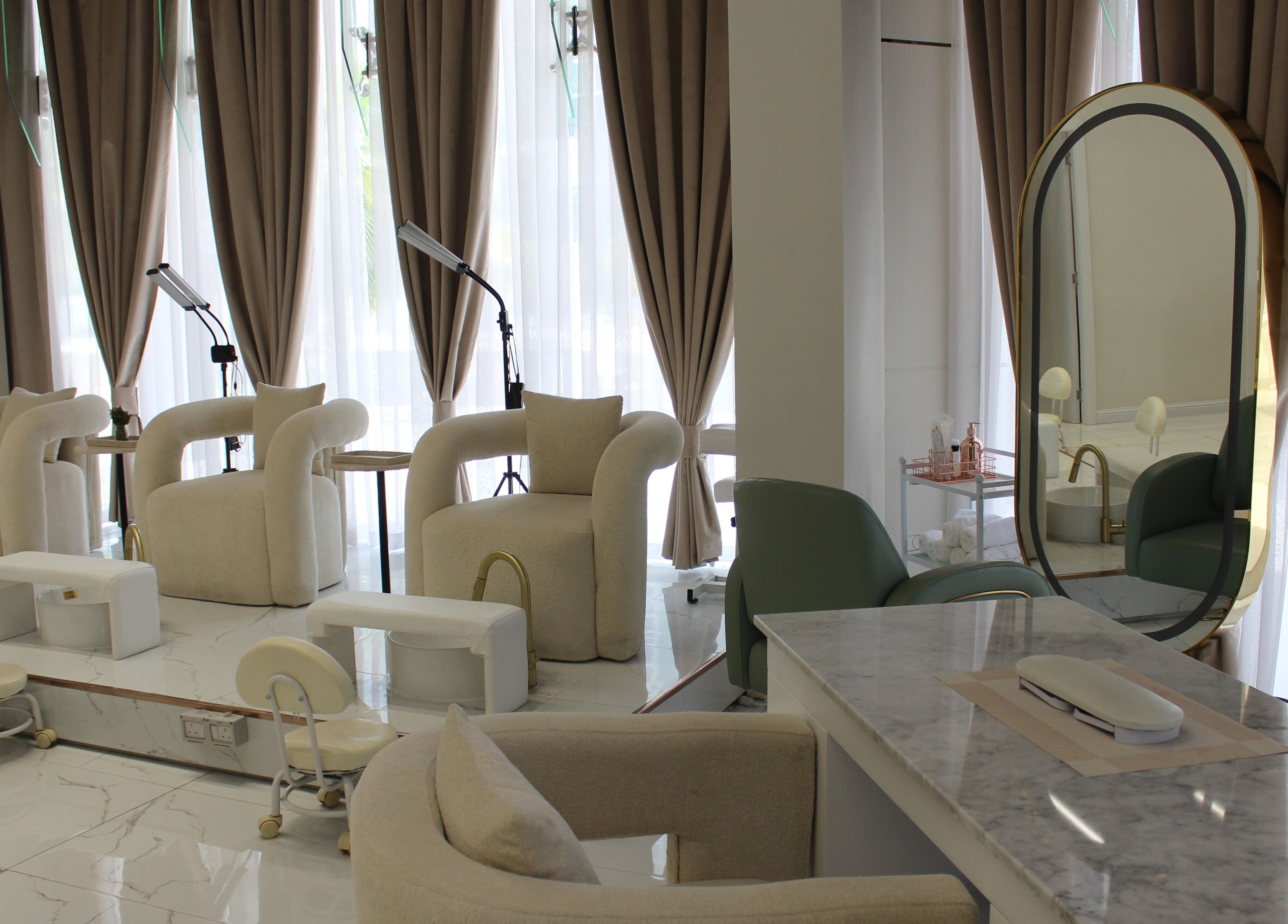 Luxurious interior of Palm Aura Beauty Salon, Dubai, Dubai, AE, featuring plush seating and elegant decor.