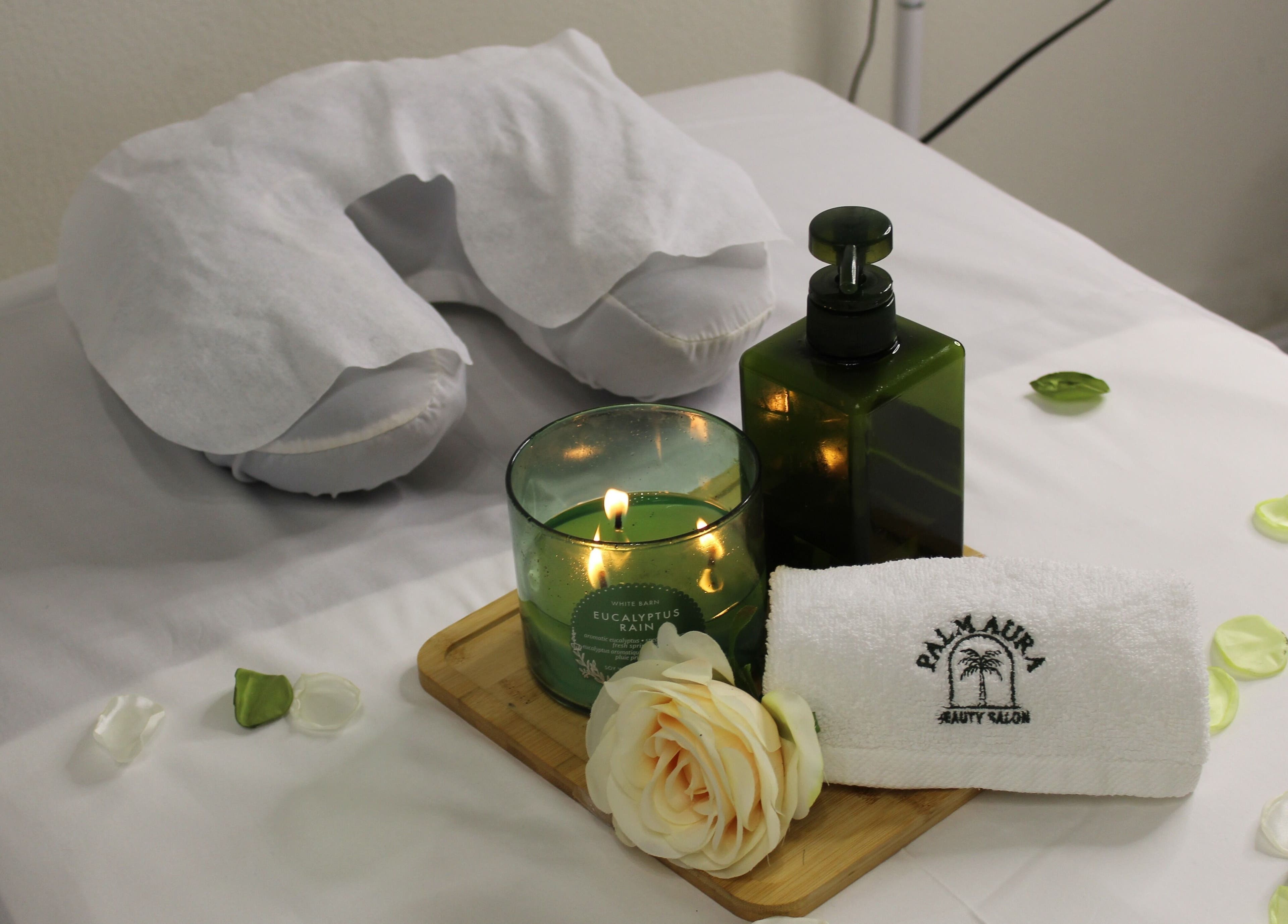 Relaxing setup with candle and towel at Palm Aura Beauty Salon, Dubai, Dubai, AE.