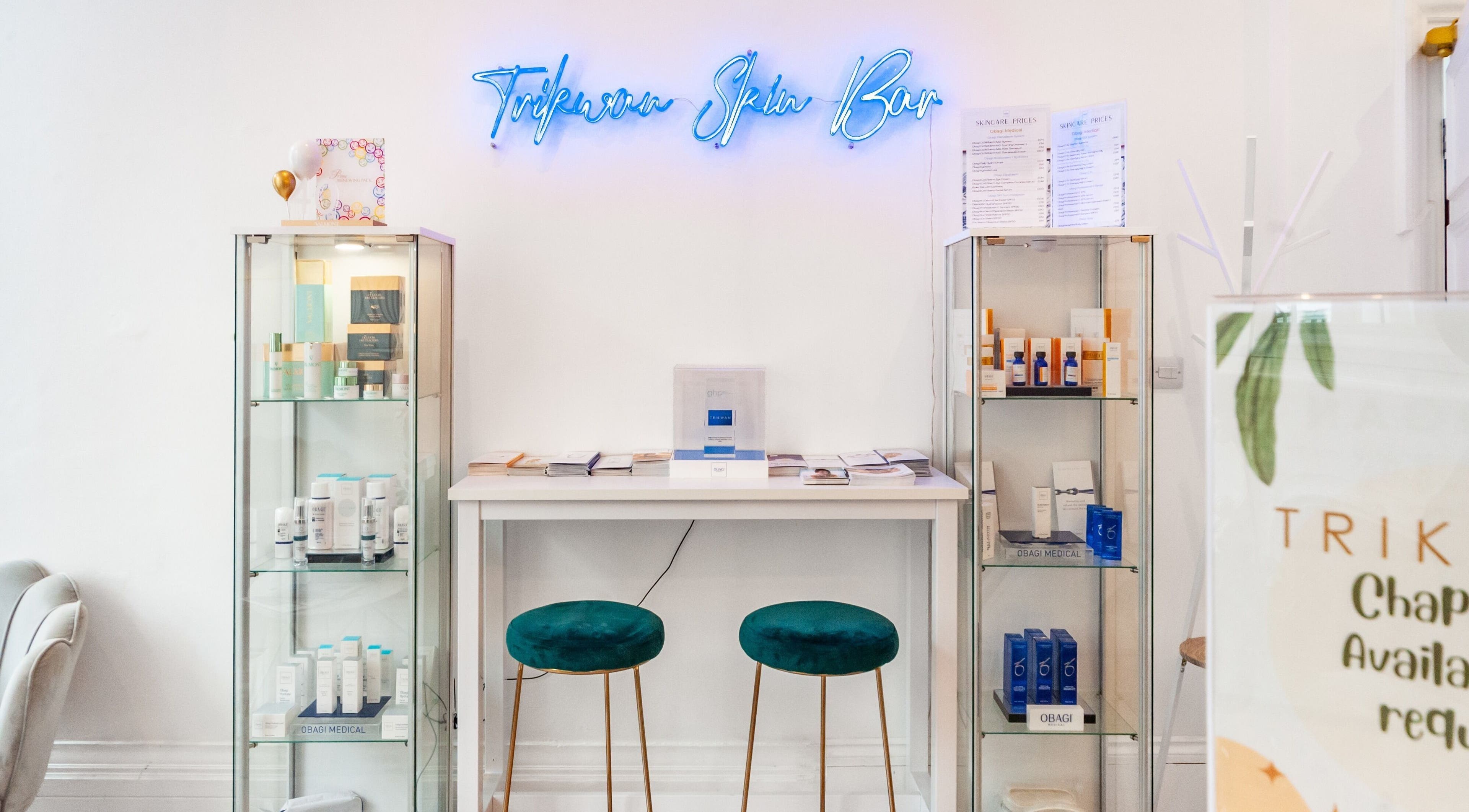 Elegant interior of Trikwan Aesthetics in London, England, GB showcasing skincare products and services.