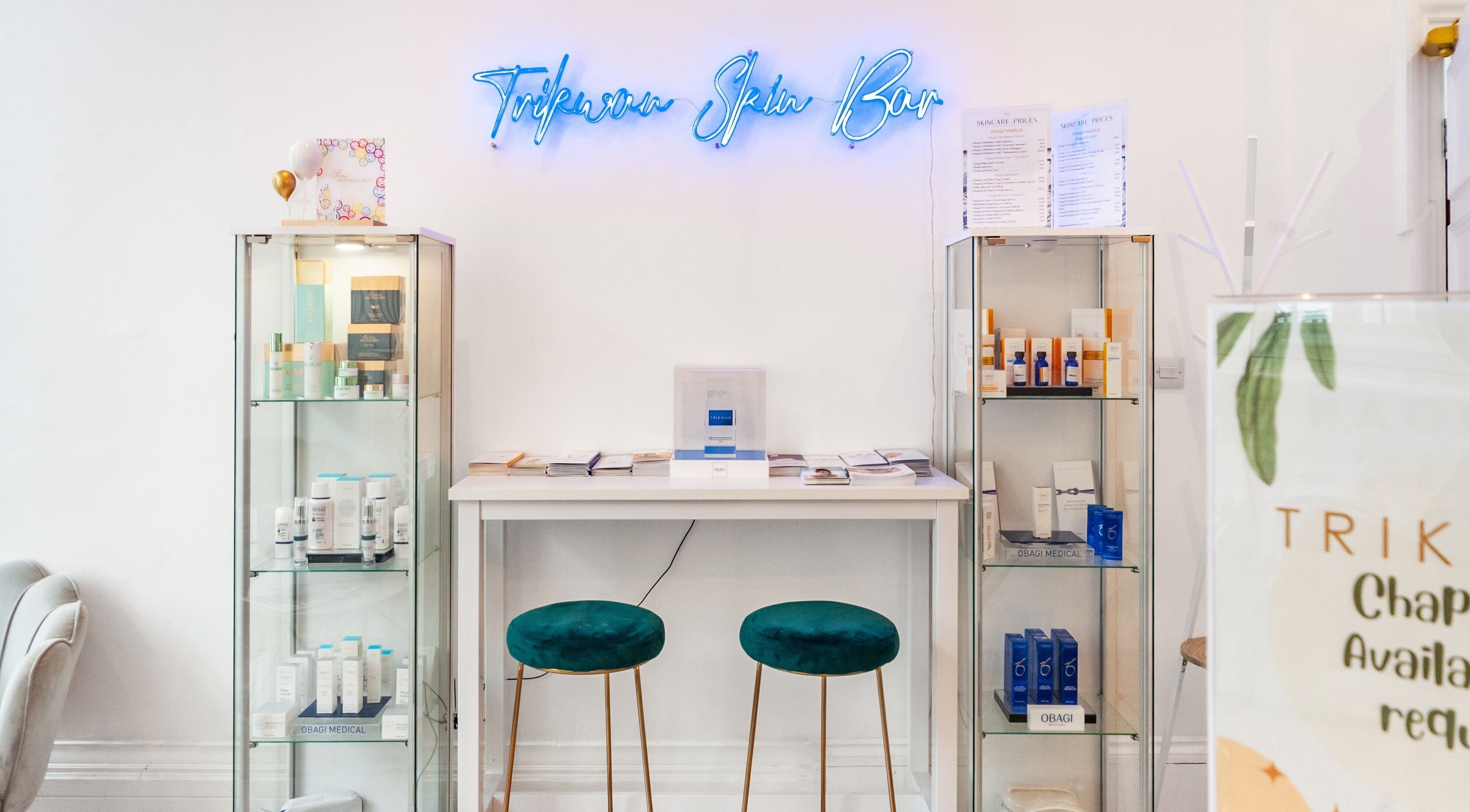 Elegant interior of Trikwan Aesthetics in London, England, GB showcasing skincare products and services.
