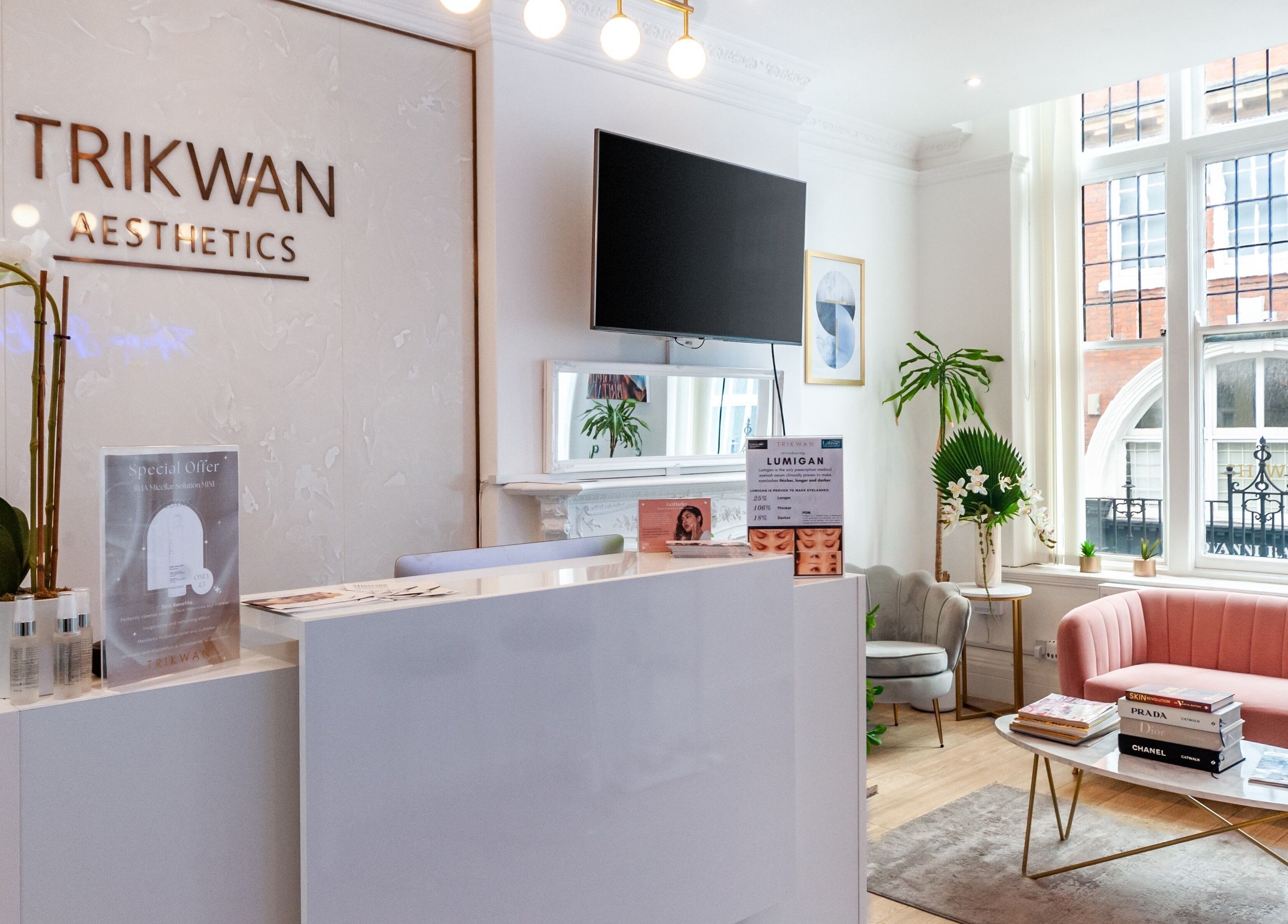 Elegant reception area at Trikwan Aesthetics, London, England, GB with modern decor and plush seating.