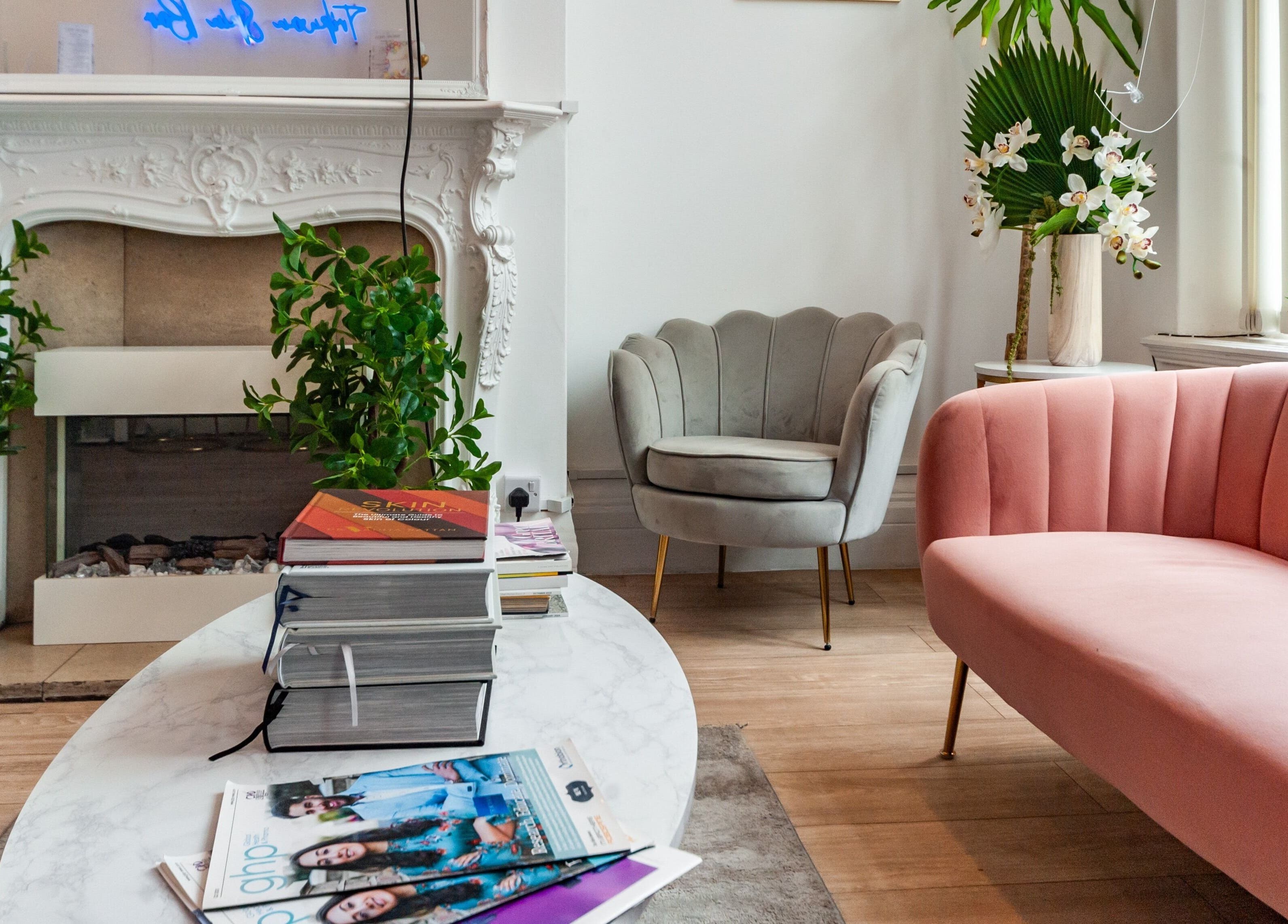 Elegant waiting area at Trikwan Aesthetics, London, England, GB, featuring plush seating and modern decor.