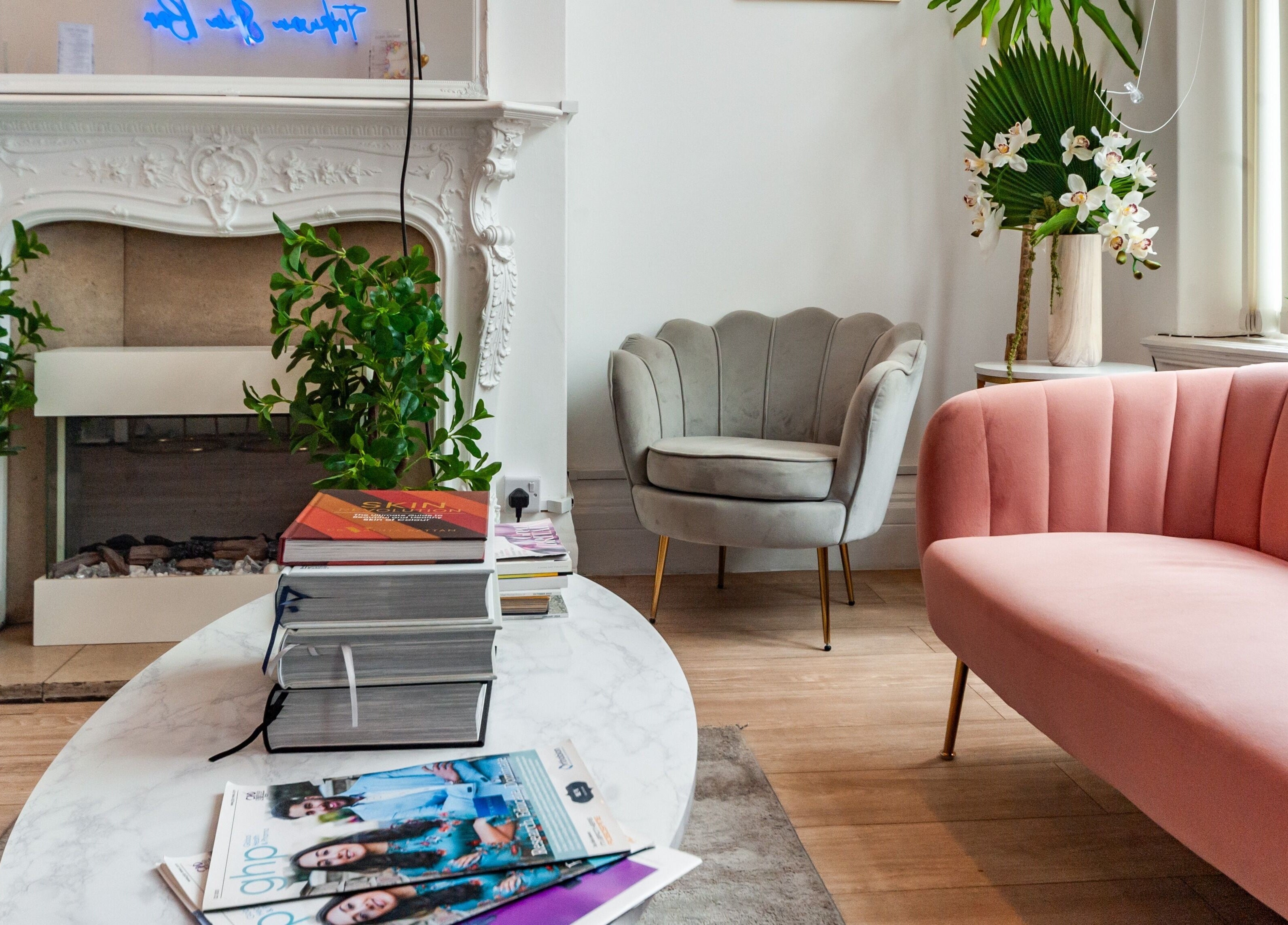 Elegant waiting area at Trikwan Aesthetics, London, England, GB, featuring plush seating and modern decor.