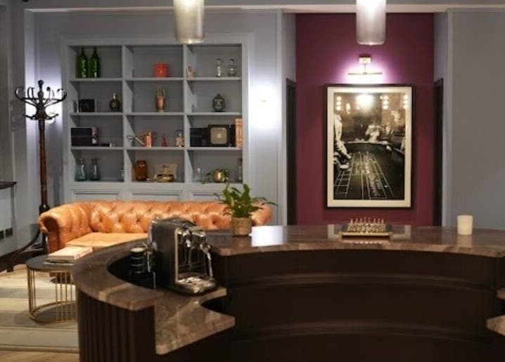 Elegant reception at Lilium Aesthetic Clinic, London, England with chic decor and plush seating.