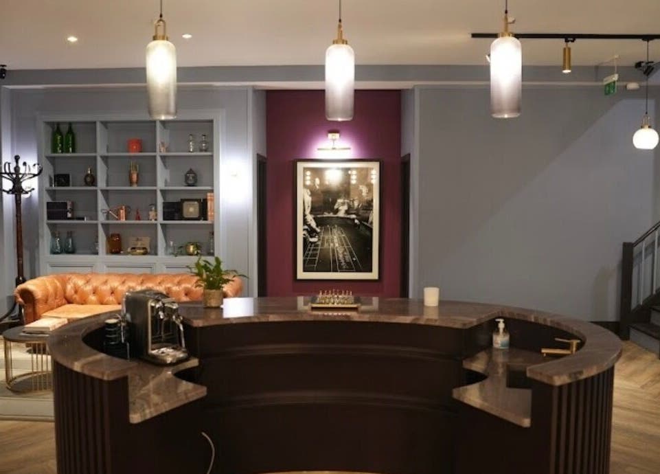 Sophisticated interior of Lilium Aesthetic Clinic, London, England, GB, showcasing plush seating and elegant design.