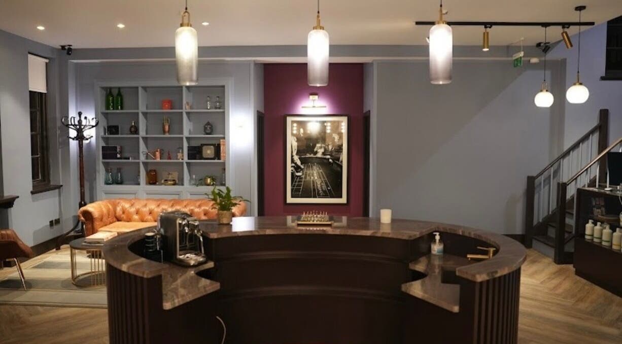 Sophisticated interior of Lilium Aesthetic Clinic, London, England, GB, showcasing plush seating and elegant design.