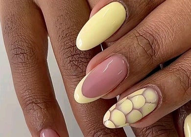 Stylish nail design at La Beaute by Carine in Randburg, Gauteng, ZA showcasing pink and yellow artistry.