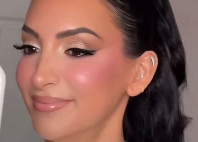 Woman with radiant makeup at La Beaute by Carine, Randburg, Gauteng, ZA, showcasing elegant beauty.