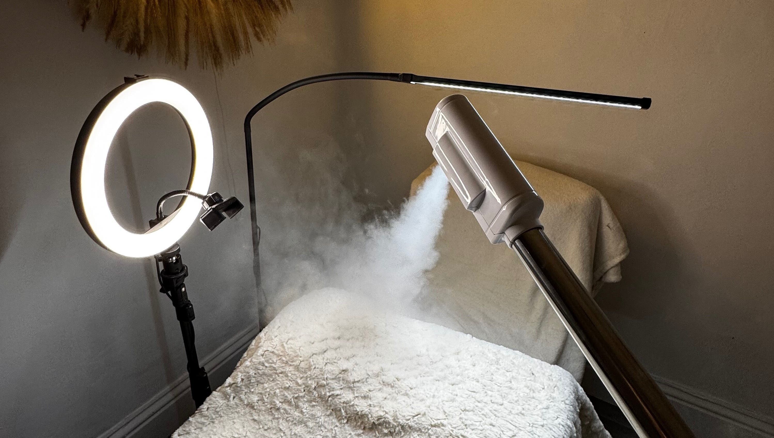 Cozy treatment room at Luminous with Lil in Barrow-in-Furness, England with steam and ring light.