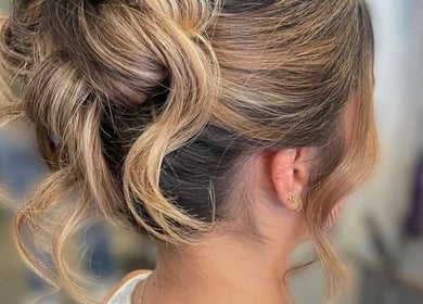 Sophisticated blonde updo at Gloss Glo & Blo, Paisley, Scotland, GB enhancing style and elegance.