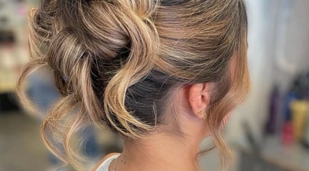 Sophisticated blonde updo at Gloss Glo & Blo, Paisley, Scotland, GB enhancing style and elegance.