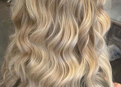Elegant blonde waves styled at Gloss Glo & Blo, Paisley, Scotland, GB.