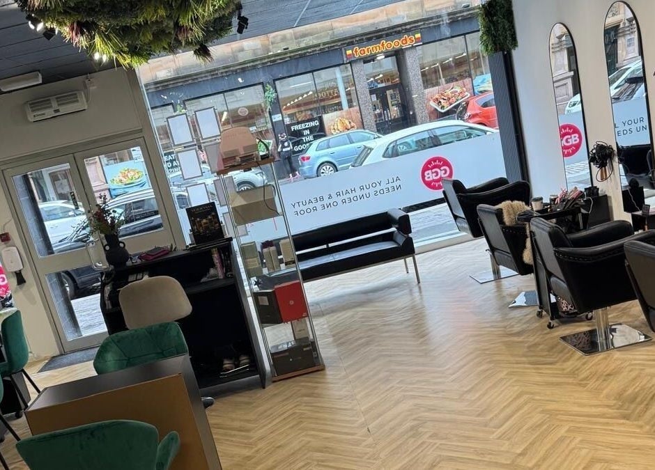 Gloss Glo & Blo salon interior in Paisley, Scotland, GB. Elegant chairs and mirrors create a stylish ambiance.