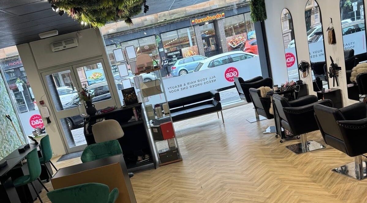 Gloss Glo & Blo salon interior in Paisley, Scotland, GB. Elegant chairs and mirrors create a stylish ambiance.