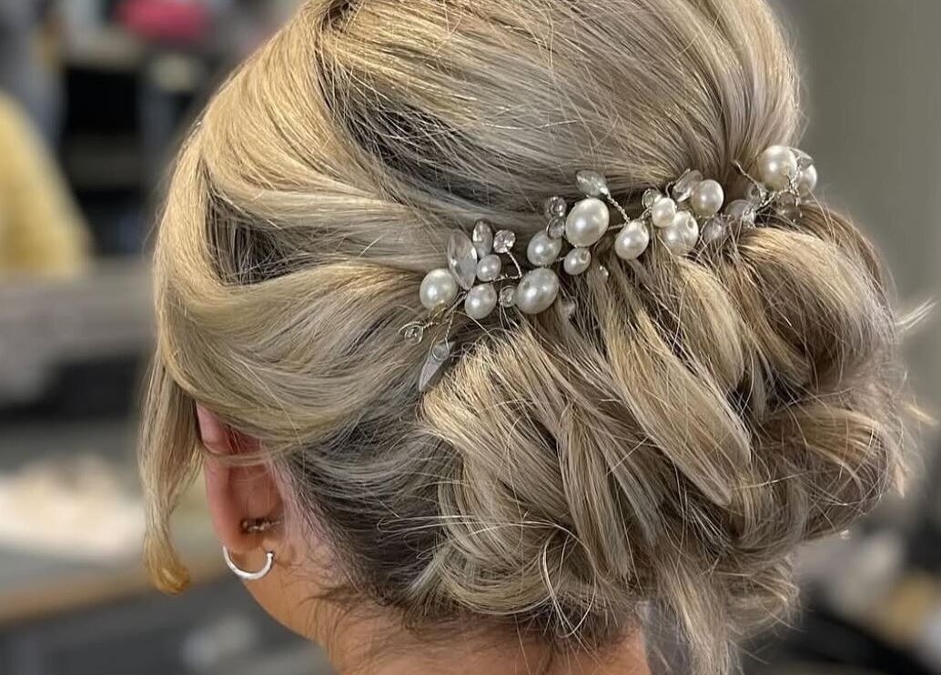 Elegant blonde updo with pearls at Gloss Glo & Blo, Paisley, Scotland, GB.