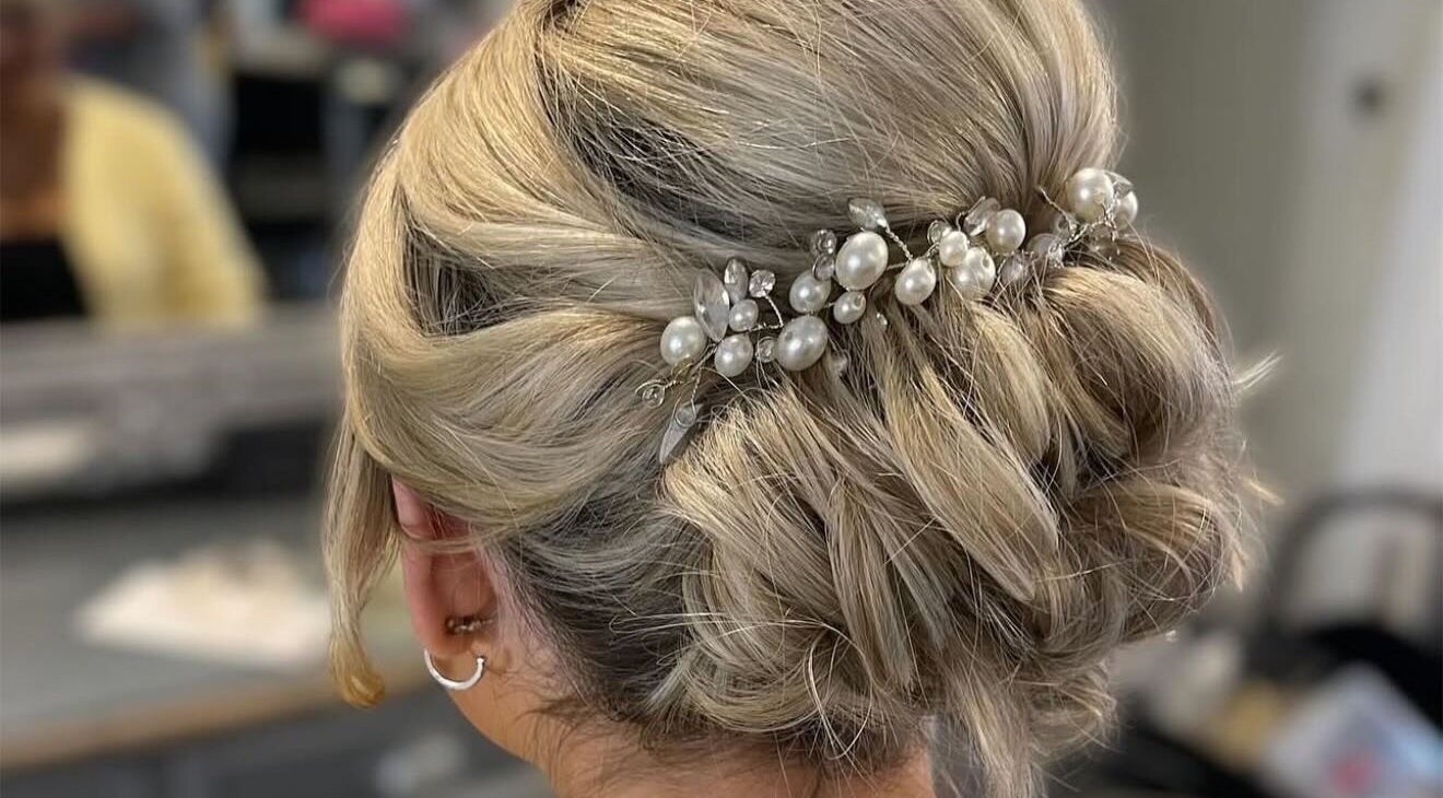 Elegant blonde updo with pearls at Gloss Glo & Blo, Paisley, Scotland, GB.