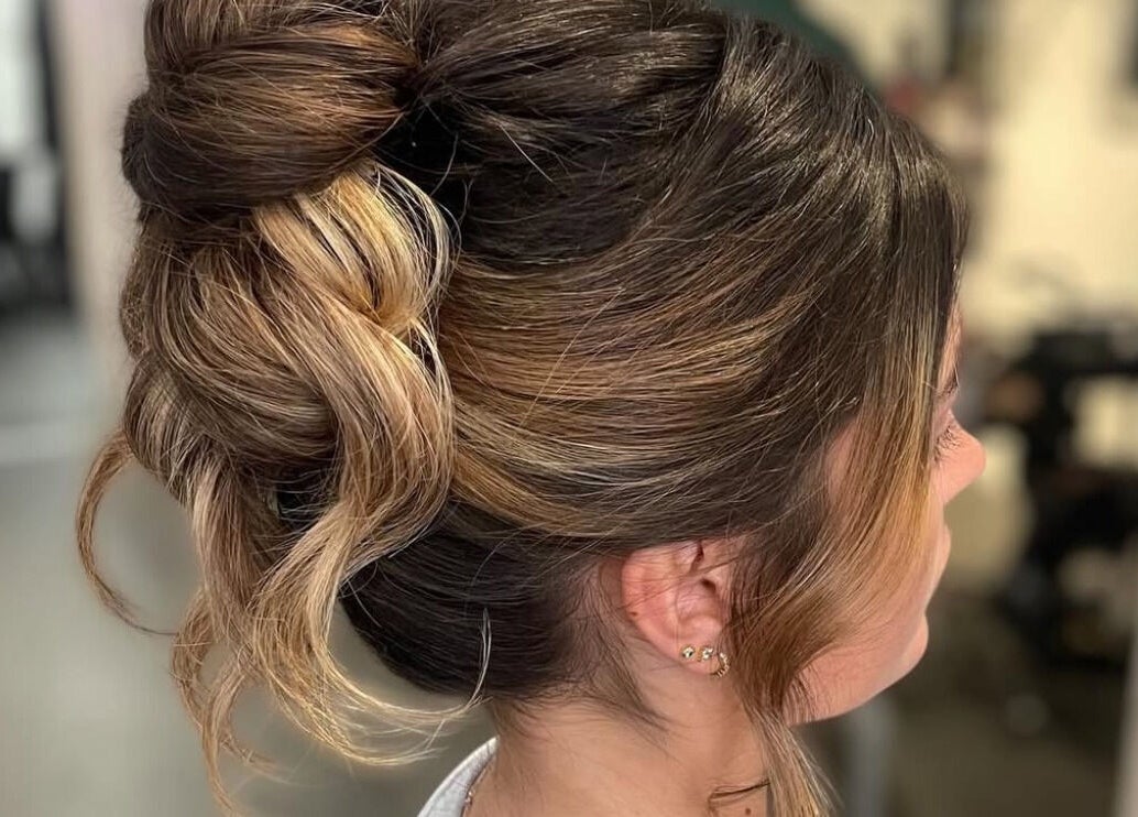 Chic brunette updo hairstyle at Gloss Glo & Blo in Paisley, Scotland, GB.