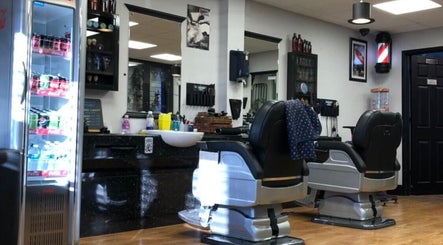 Interior of Paul's Hairdressing for Men in Wallsend, England, GB with barber chairs and grooming tools.