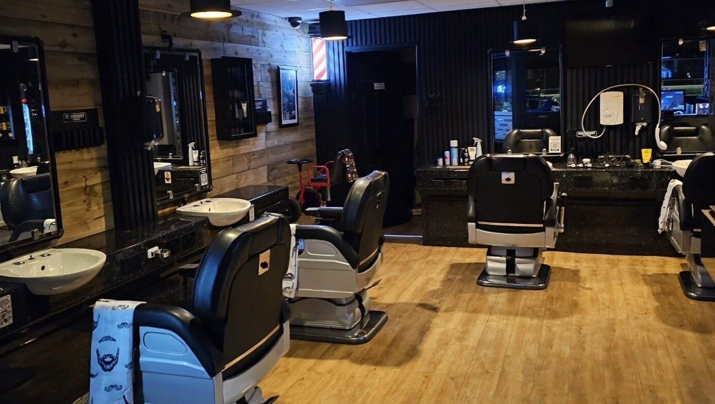 Interior of Paul's Hairdressing for Men in Wallsend, featuring stylish chairs and decor.