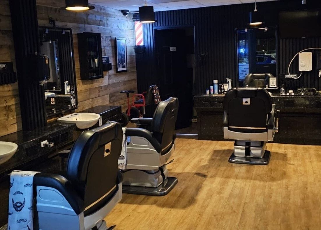 Interior of Paul's Hairdressing for Men in Wallsend, featuring stylish chairs and decor.
