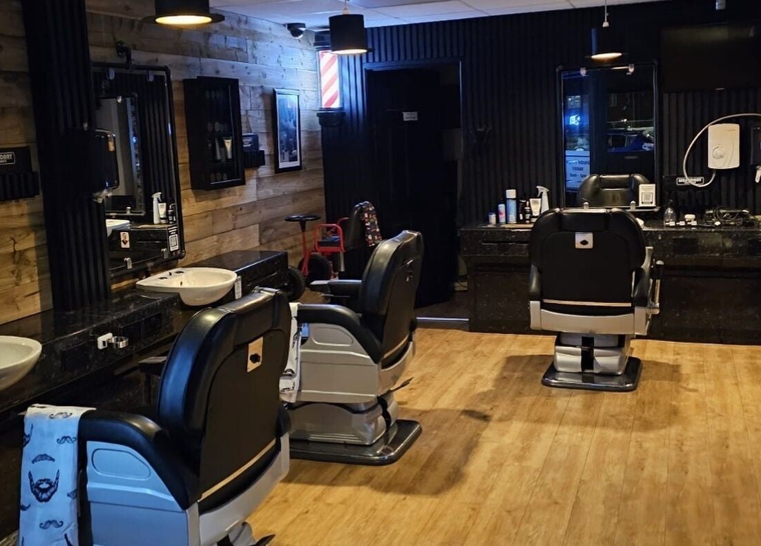 Interior of Paul's Hairdressing for Men in Wallsend, featuring stylish chairs and decor.
