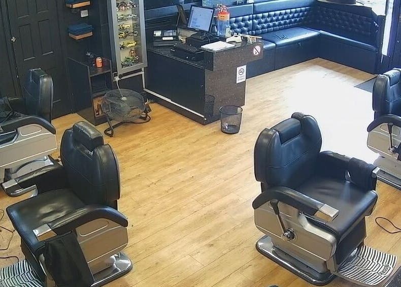 Interior view of Paul's Hairdressing for Men, Wallsend, England, GB, featuring modern barber chairs and stylish decor.
