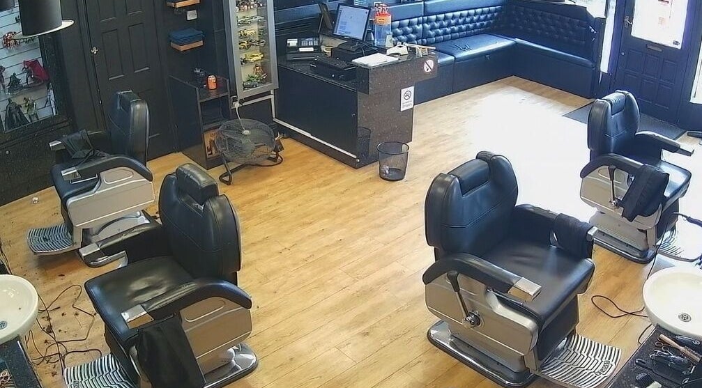 Interior view of Paul's Hairdressing for Men, Wallsend, England, GB, featuring modern barber chairs and stylish decor.