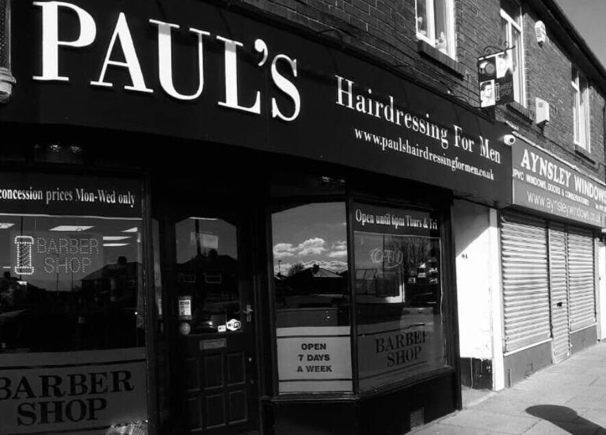 Exterior of Paul's Hairdressing for Men, Wallsend, England, GB, showcasing the shop's entrance and signage.