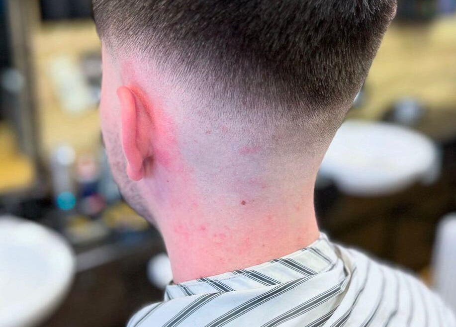 Close-up of a man's precision fade haircut at Paul's Hairdressing for Men in Wallsend, England, GB.