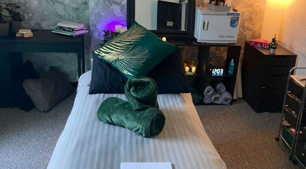 Relaxing massage room at Balanced Boutique, Newtownards, Northern Ireland, GB with cozy décor and soft lighting.