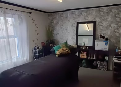 Calming therapy room at Balanced Boutique, Newtownards, Northern Ireland, GB with elegant décor and soft lighting.