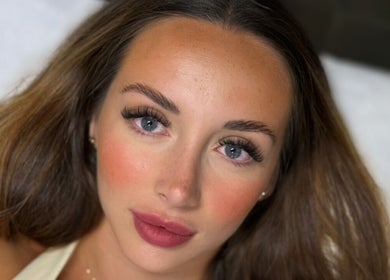 Close-up of a woman's face with flawless makeup at Kiah Lopez Beauty, Gibraltar, GI.